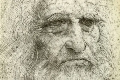 Szkic przedstawia zmęczoną twarz, prawdopodobnie autoportret Leonardo da Vinci, z charakterystyczną brodą i zmarszczkami.