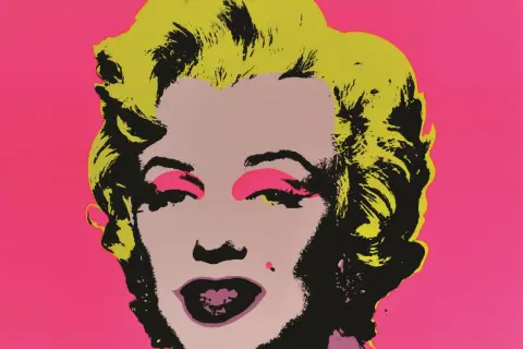 Ikona pop artu Andy Warhol w swoim stylu przedstawia Marilyn Monroe z jaskrawożółtymi włosami i różowym tłem.