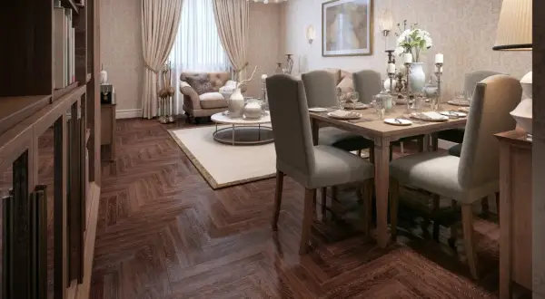 Elegancki salon z jadalnią w stylu art deco, z drewnianą podłogą w jodełkę, wygodną sofą i nakrytym stołem.