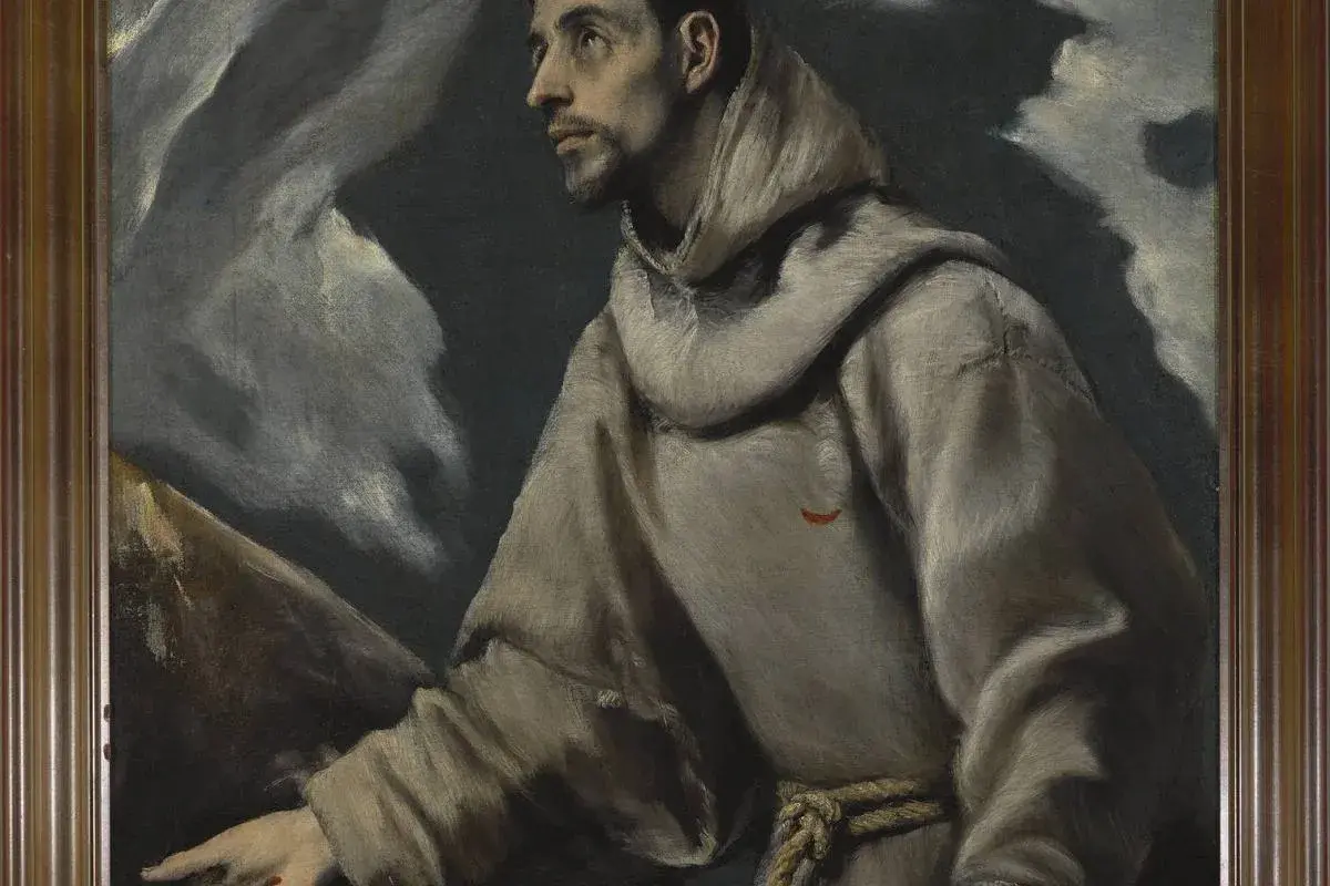 Święty Franciszek w szarym habicie, jedno z dzieł El Greco, z charakterystycznym, wyciągniętym palcem i mistycznym tłem.