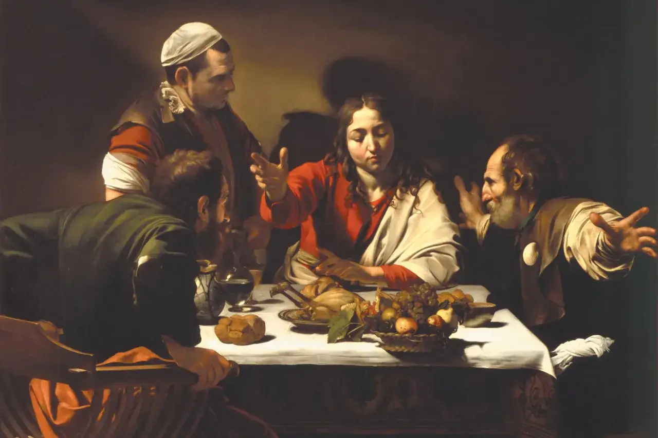 Wieczerza w Emaus Caravaggia: Jezus błogosławi posiłek, a jego towarzysze rozpoznają go w geście zdumienia.