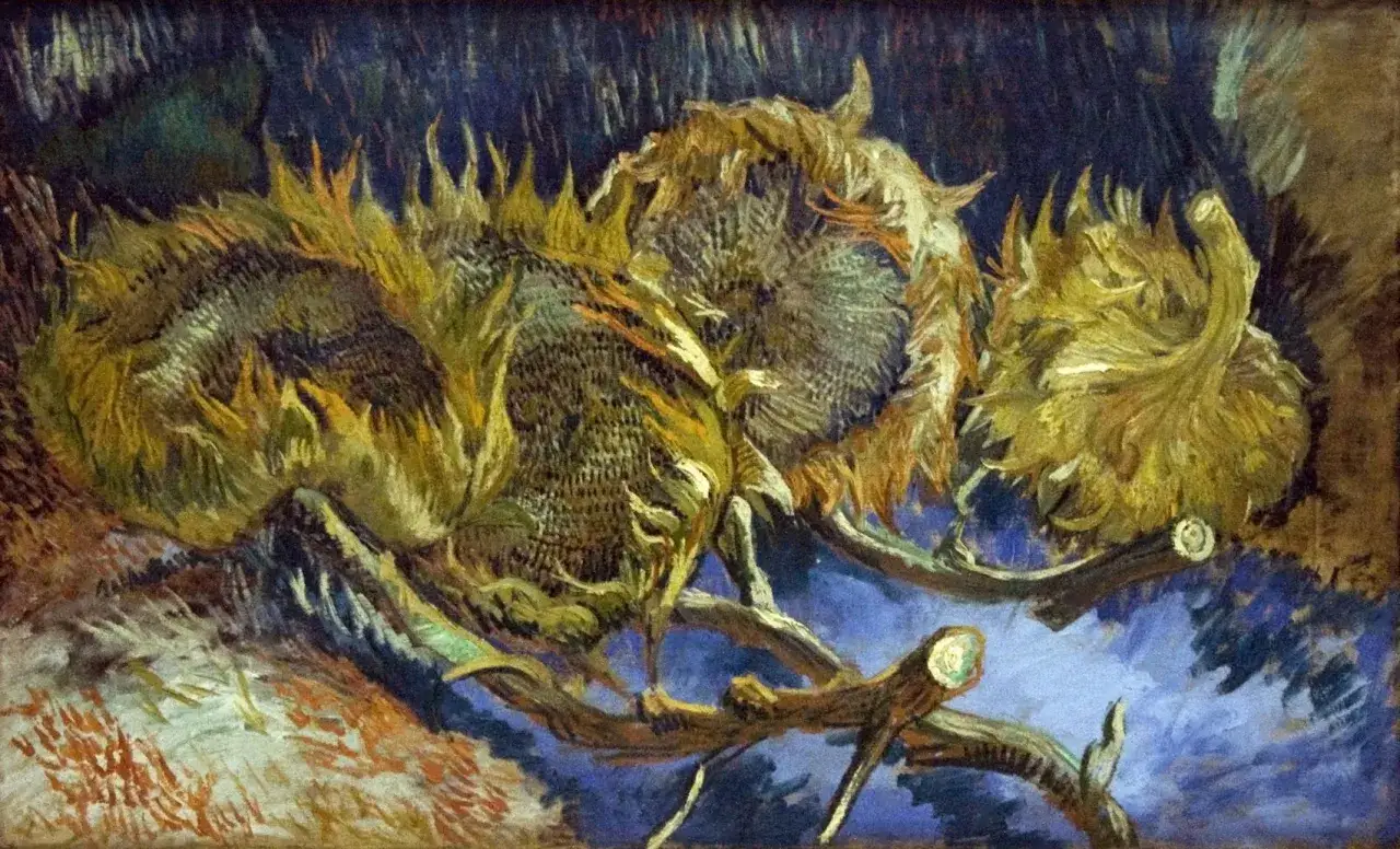 Martwa natura van Gogha: zwiędłe słoneczniki na ciemnym tle, ich płatki opadają, tworząc dramatyczny obraz.