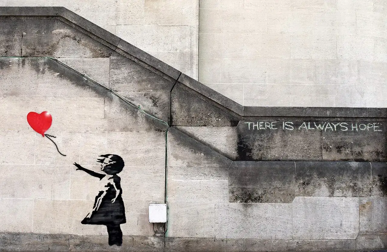 Dziewczynka z balonikiem znaczenie: Banksy'ego dzieło na schodach. Czarna sylwetka dziewczynki sięga po czerwony balon w kształcie serca. Napis 