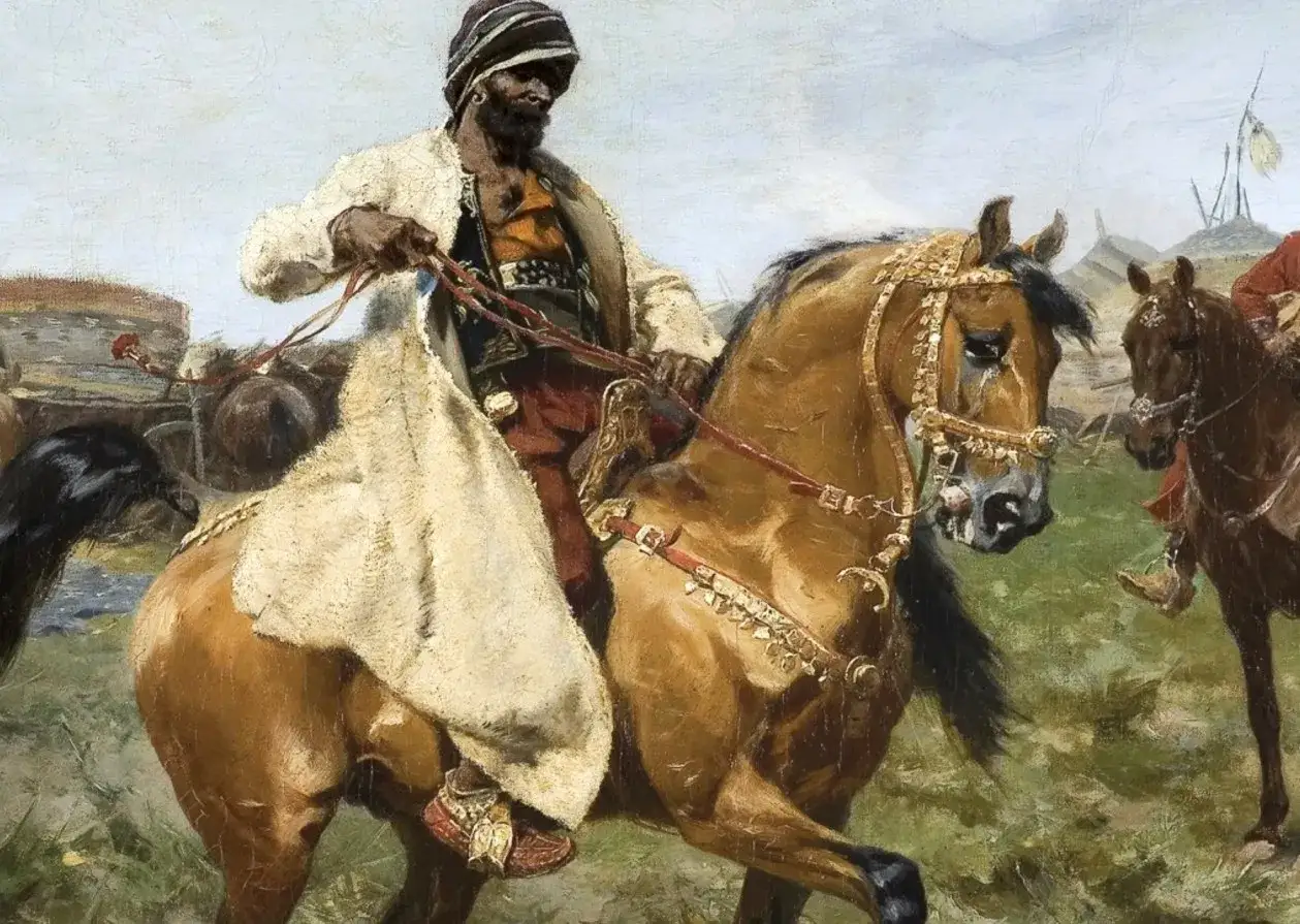J&oacute;zef Brandt obrazy: jeździec w orientalnym stroju na koniu, w tle ob&oacute;z.