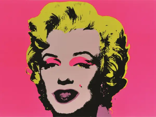 Ikona pop artu Andy Warhol w swoim stylu przedstawia Marilyn Monroe z jaskrawożółtymi włosami i różowym tłem.